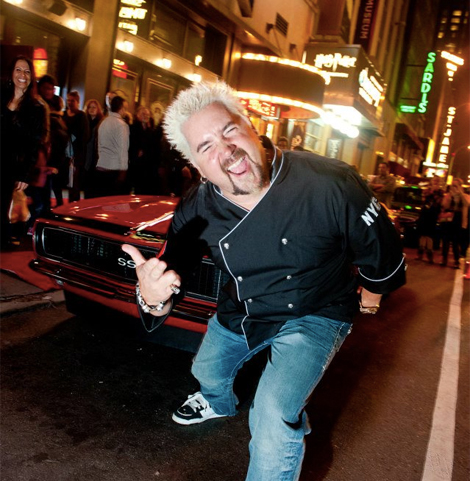 Guy Fieri outside his Times Square restaurant. (Photo: Facebook)